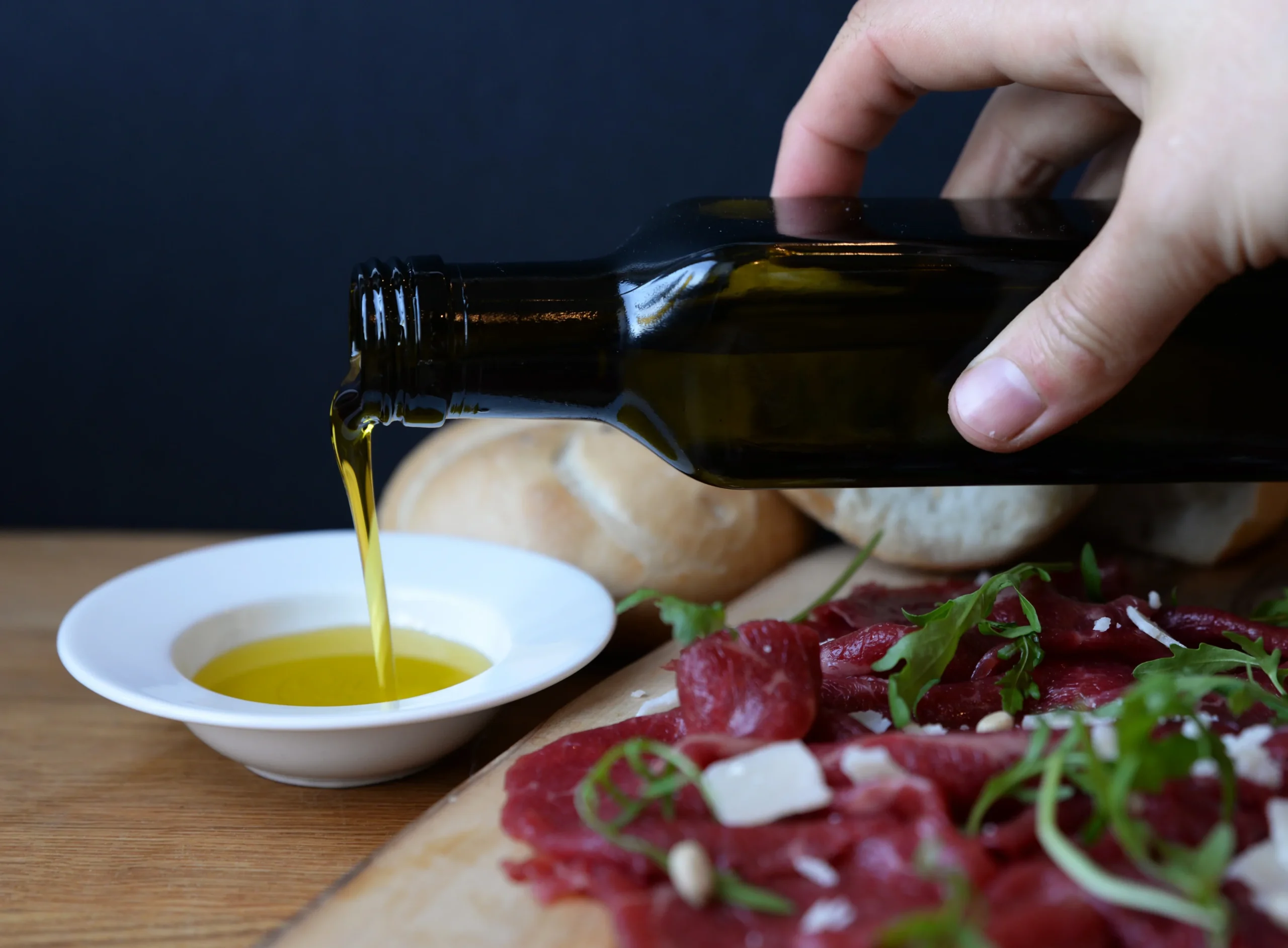 oil drizzling over fresh ingredients oil drizzling over fresh ingredients