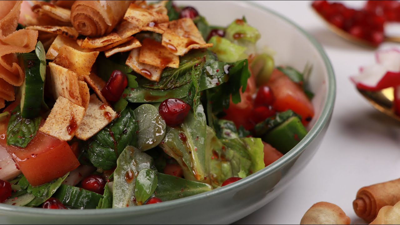 colorful fresh salad with pomegranate and crispy toppings